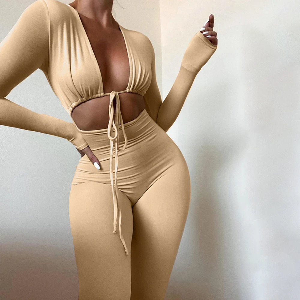 Fashionable new solid color tight fitting sexy exposed navel lace up hollow long sleeved slim fit jumpsuit