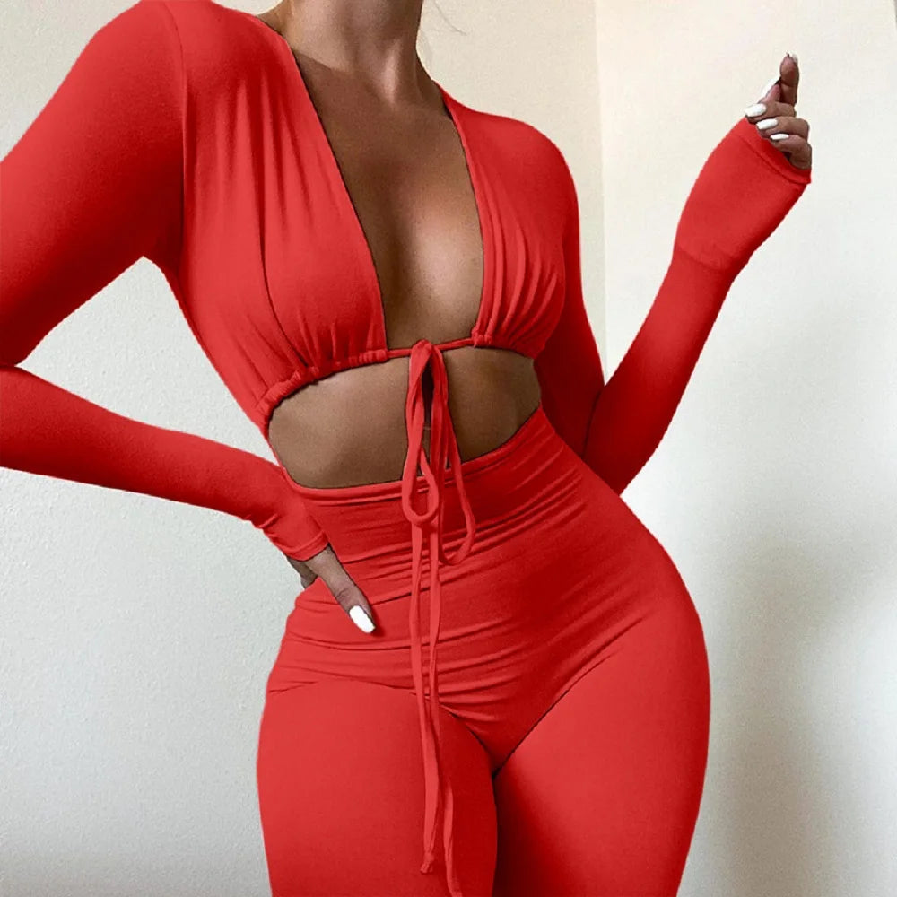 Fashionable new solid color tight fitting sexy exposed navel lace up hollow long sleeved slim fit jumpsuit